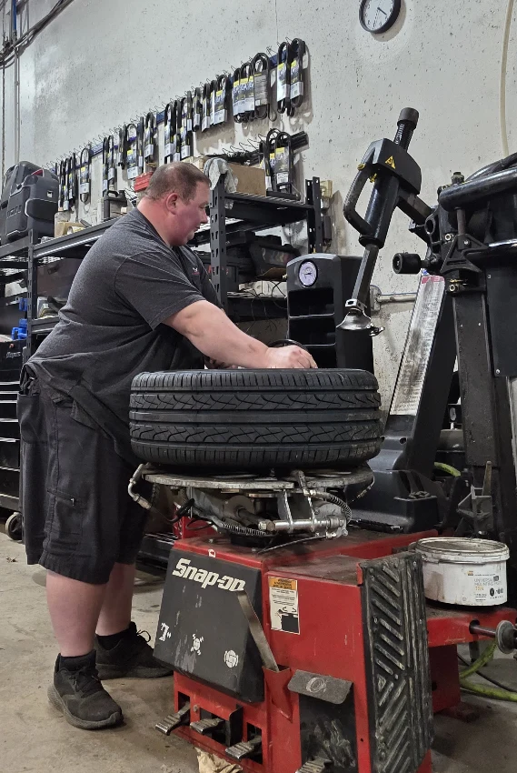 man working on a tire