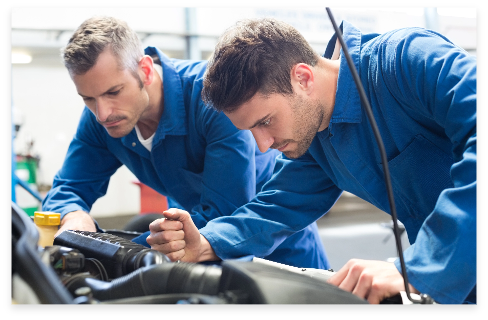 Automotive technicians working on a vehicle