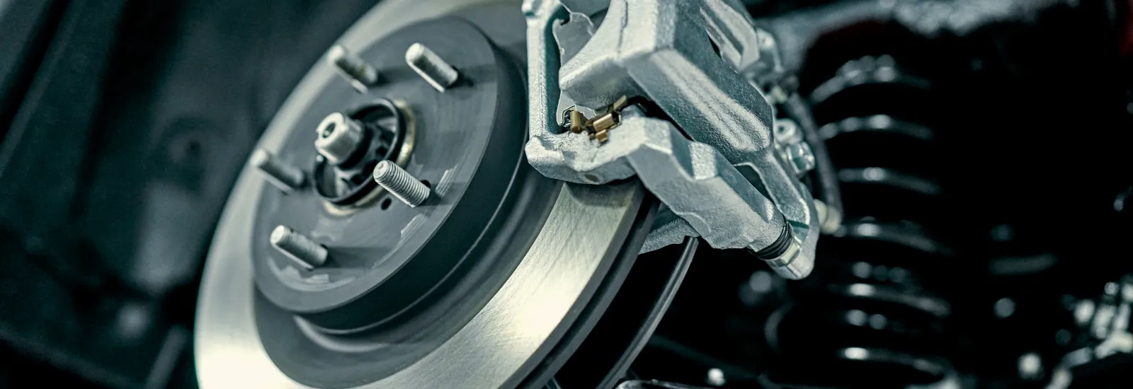 Mechanic working on car brakes
