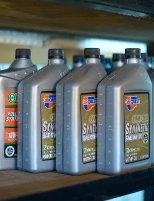 tech working on car engine