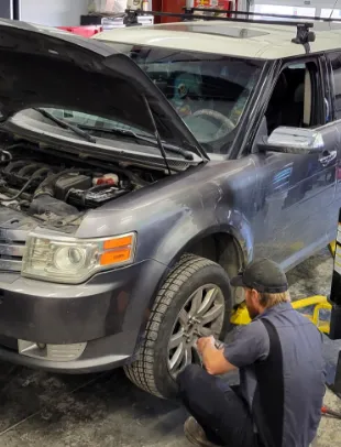 tech changing a tire
