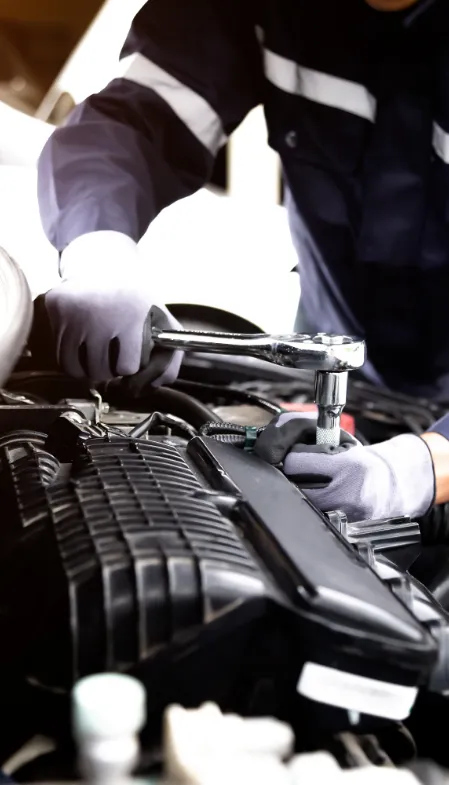 mechanic working on an engine