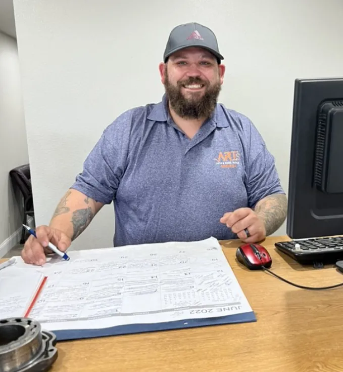 woman smiling sitting at a desk
