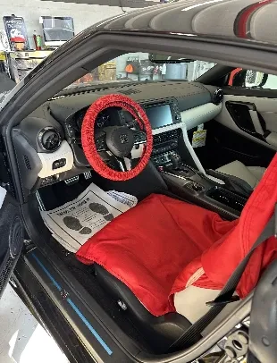 tech working on car engine