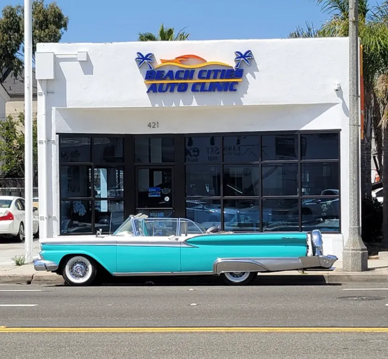 antique car in front of shop