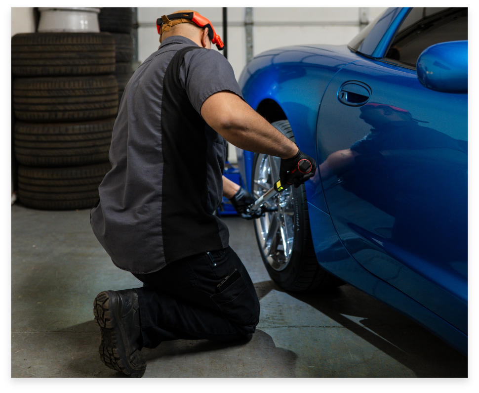 Technician working on vehicle