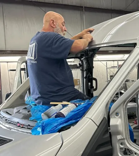 collision repair tech working